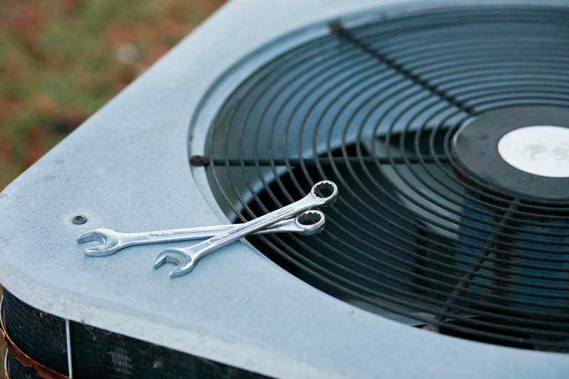 ac-unit-with-wrenches-on-it